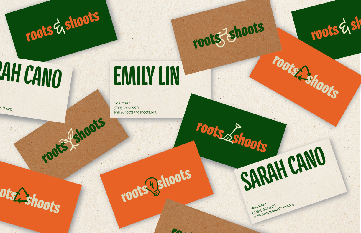 Scattered Roots & Shoots business cards in green, kraft, orange and cream