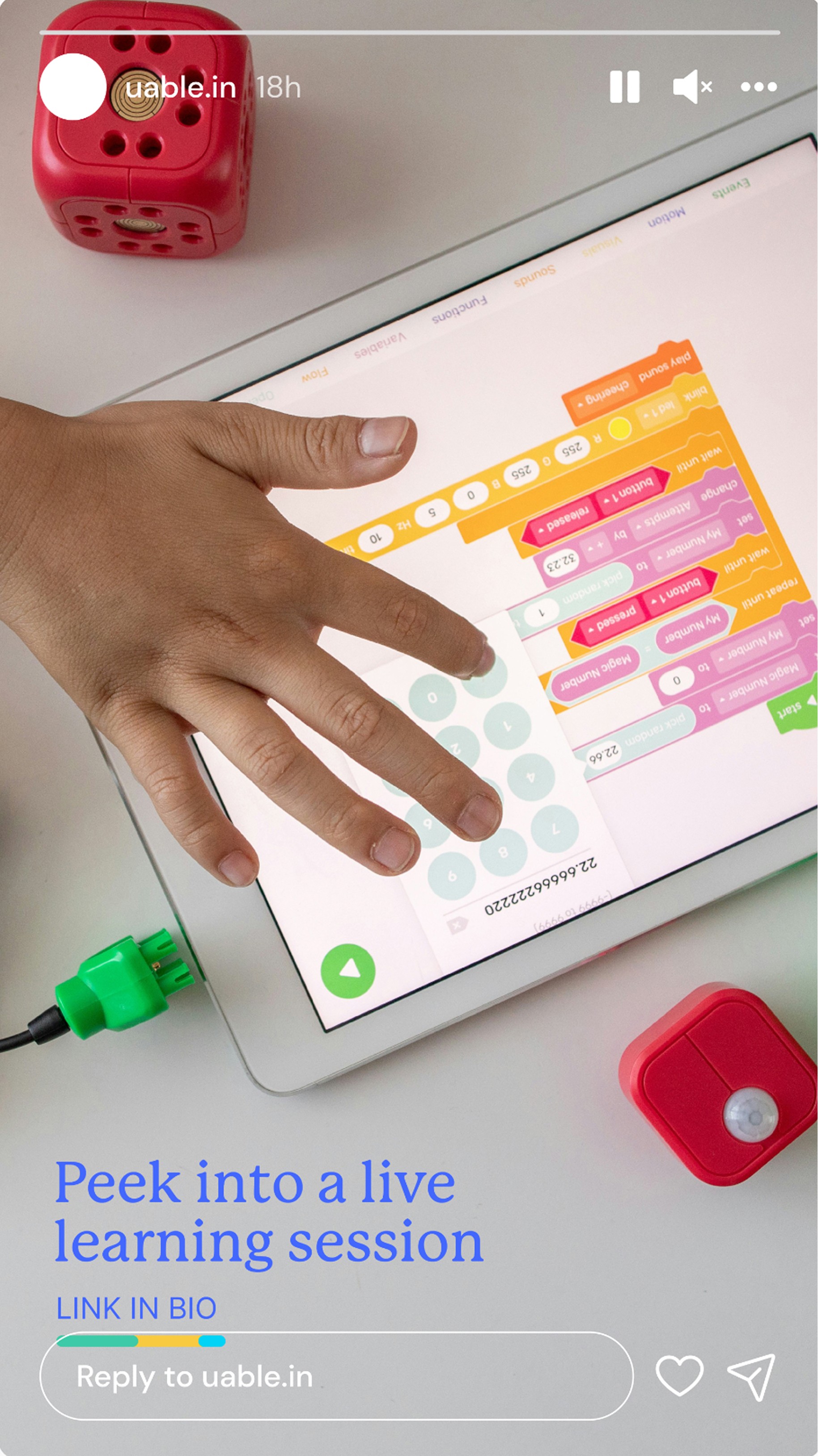 Uable story: peek into a live learning session, a hand coding on a tablet